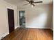 Living room featuring hardwood floors and a view into the kitchen at 921 Alabama Ave, Durham, NC 27705