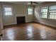 Empty living room featuring hardwood floors and lots of light at 921 Alabama Ave, Durham, NC 27705