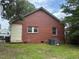 Exterior shot showing the rear of the brick house at 921 Alabama Ave, Durham, NC 27705
