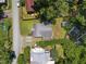 Aerial view of home with mature tree coverage and gravel road at 101 Goldston Dr, Carrboro, NC 27510