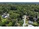Aerial view of quiet neighborhood with mature trees and gravel road at 101 Goldston Dr, Carrboro, NC 27510