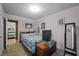 Bedroom with a treadmill, mirrored dresser, and a cozy quilt at 101 Goldston Dr, Carrboro, NC 27510