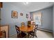 Dining room featuring hardwood floors, a wooden table, and four chairs at 101 Goldston Dr, Carrboro, NC 27510