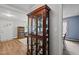 Living room featuring a display cabinet with glass shelves, hardwood floors, and plenty of light at 101 Goldston Dr, Carrboro, NC 27510