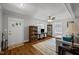 Comfortable living room featuring an area rug, ceiling fan, and natural light at 101 Goldston Dr, Carrboro, NC 27510