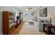 Bright living room featuring a comfortable sectional sofa, elegant decor, and hardwood floors at 101 Goldston Dr, Carrboro, NC 27510