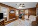 Comfortable living room area with wood paneling, light-colored walls, and a neutral-toned recliner at 101 Goldston Dr, Carrboro, NC 27510