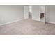 Large bedroom with neutral carpeting, ensuite bathroom and plenty of natural light at 1018 Excite Ave, Morrisville, NC 27560