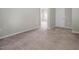 Bright bedroom with neutral walls, plush carpet, and doorway to the adjacent space at 1018 Excite Ave, Morrisville, NC 27560