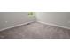 Neutral carpeted bedroom with minimal natural light and light-colored walls at 1018 Excite Ave, Morrisville, NC 27560