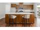 Spacious kitchen featuring a large island with barstool seating and modern appliances at 1018 Excite Ave, Morrisville, NC 27560
