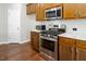 Modern kitchen with stainless steel appliances, quartz countertops, and ample cabinet space at 1018 Excite Ave, Morrisville, NC 27560