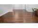 A hardwood floor is found in this living room, which features a hall, stairs and a door at 1018 Excite Ave, Morrisville, NC 27560