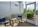 Outdoor screened-in porch featuring a table and chairs, great for relaxing and entertaining at 1018 Excite Ave, Morrisville, NC 27560