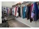 Well-organized walk-in closet with ample storage and carpet flooring at 1018 Excite Ave, Morrisville, NC 27560