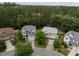 Aerial view of two well-maintained homes, showcasing their curb appeal and lush green surroundings in a desirable neighborhood at 1040 Bellenden Dr, Durham, NC 27713