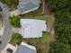 Aerial view of a home showcasing its layout, landscaping, and private backyard space, nestled in a quiet neighborhood at 1040 Bellenden Dr, Durham, NC 27713