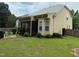 Exterior view of home featuring a screened porch, landscaped yard, and back of the house at 1040 Bellenden Dr, Durham, NC 27713