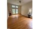 Cozy bedroom featuring hardwood floors, neutral walls, and a ceiling fan for added comfort at 1040 Bellenden Dr, Durham, NC 27713