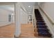 Foyer with a staircase and hardwood floors leading to other rooms at 1040 Bellenden Dr, Durham, NC 27713