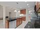 Modern kitchen with a central island, stainless steel dishwasher, and ample cabinet space at 1040 Bellenden Dr, Durham, NC 27713