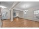Bright living room with hardwood floors, large windows, and an open layout perfect for entertaining guests at 1040 Bellenden Dr, Durham, NC 27713