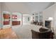 Open living area with fireplace, large windows and view to kitchen at 1040 Bellenden Dr, Durham, NC 27713