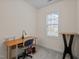 Bright office space featuring a window, desk, office chair, and a sleek black table at 1040 Bellenden Dr, Durham, NC 27713