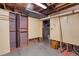 Partially finished basement with peg board, exposed duct work and visible ceiling beams at 106 Lattimore Ln, Durham, NC 27713