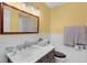 Stylish bathroom with marble countertops, dark wood cabinets, and modern fixtures at 106 Lattimore Ln, Durham, NC 27713