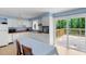 Cozy kitchen featuring white appliances, wood counters, and a dining table with a view of the deck at 106 Lattimore Ln, Durham, NC 27713