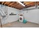 Bright laundry area with white walls, washer, and a laundry basket for convenient cleaning at 106 Lattimore Ln, Durham, NC 27713