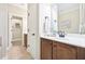 Bathroom with wooden cabinets and neutral tile flooring at 1090 Indigo Ridge Pl, Cary, NC 27519