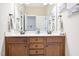 Bathroom featuring double sinks, a mirror, and a neutral color palette at 1090 Indigo Ridge Pl, Cary, NC 27519