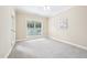 Bright bedroom with carpet, a ceiling fan, and a large window at 1090 Indigo Ridge Pl, Cary, NC 27519