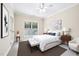 Bright bedroom with carpet, a ceiling fan, and a large window at 1090 Indigo Ridge Pl, Cary, NC 27519