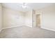 Bedroom featuring plush carpet, neutral walls, and an open doorway at 1090 Indigo Ridge Pl, Cary, NC 27519