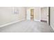 Bright bedroom with carpet and a large window at 1090 Indigo Ridge Pl, Cary, NC 27519