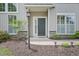 Inviting front entrance with a decorative lamp post and manicured landscaping at 1090 Indigo Ridge Pl, Cary, NC 27519