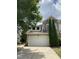 Two-story home featuring a two-car garage, stone accents, and manicured landscaping at 1090 Indigo Ridge Pl, Cary, NC 27519