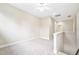 Bright loft space with neutral walls, plush carpet, a ceiling fan, and access to other rooms at 1090 Indigo Ridge Pl, Cary, NC 27519