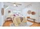 Cozy bedroom with sloped ceiling, hardwood floors, ceiling fan, and lots of natural light at 1104 Englewood Ave, Durham, NC 27701