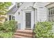 A welcoming entrance with a brick staircase, perfect for greeting guests and packages at 1104 Englewood Ave, Durham, NC 27701