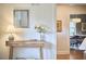 Inviting entryway showcases a console table, decorative mirror, and a glimpse into the dining area at 1104 Englewood Ave, Durham, NC 27701