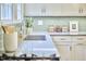 Close up of a sink in updated kitchen with modern fixtures and countertops at 1104 Englewood Ave, Durham, NC 27701