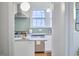 Kitchen view from doorway featuring stainless steel appliances and green backsplash at 1104 Englewood Ave, Durham, NC 27701