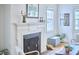A living room featuring a charming fireplace with stylish décor at 1104 Englewood Ave, Durham, NC 27701