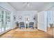 Cozy living room with french doors, hardwood floors, area rug, and comfortable seating at 1104 Englewood Ave, Durham, NC 27701