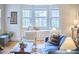 Cozy living room features a window seat, hardwood floors, and stylish furniture at 1104 Englewood Ave, Durham, NC 27701