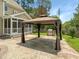 Backyard featuring a gazebo, built in stone grill, and screened in porch at 1201 Dagmar Ln, Wake Forest, NC 27587